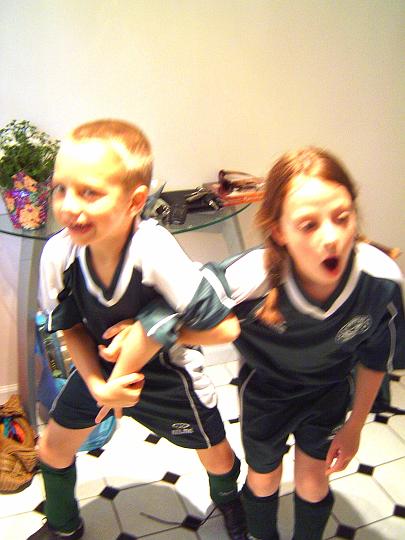 Emily and Alec getting ready for their soccer games-Mothers Day 2008.JPG